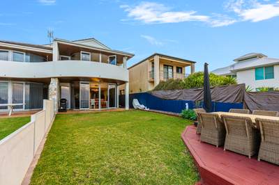 Covered alfresco area with Weber BBQ and ocean views