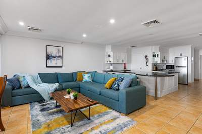 Living room with 65 inch Smart TV and ducted air conditioning